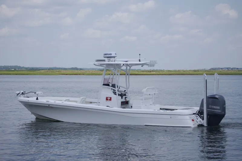 Slide: The Image of 2020 BlackJack 256 Coastal boat on calm water with Yamaha engine, side view. - 5