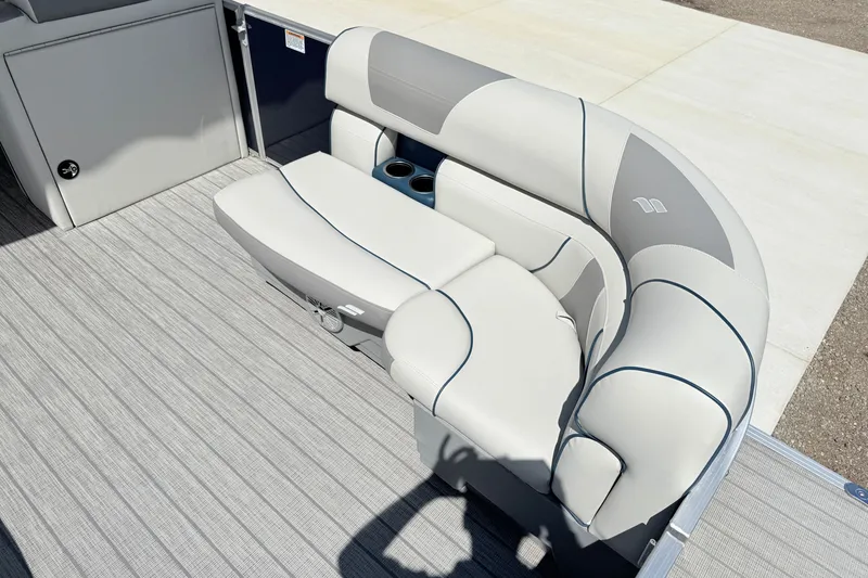 Slide: The Image of 2018 Starcraft Cruise 220 boat interior with gray cushioned seating and cup holders. - 5