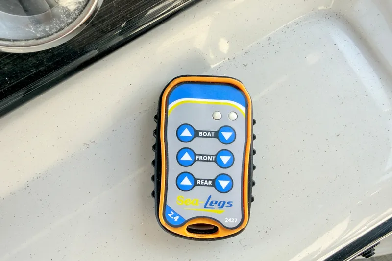 Slide: The Image of Remote control for Sea-Legs system on a 2018 Starcraft Cruise 220 boat. - 14