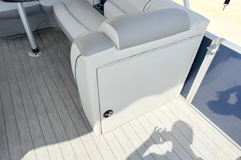 Slide: The Image of Interior of 2018 Starcraft Cruise 220 boat with gray seating and flooring. - 7