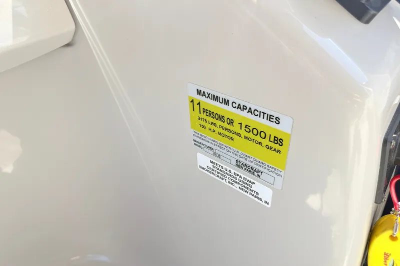 Slide: The Image of 2018 Starcraft Cruise 220 capacity label, maximum 11 persons or 1500 lbs. - 15