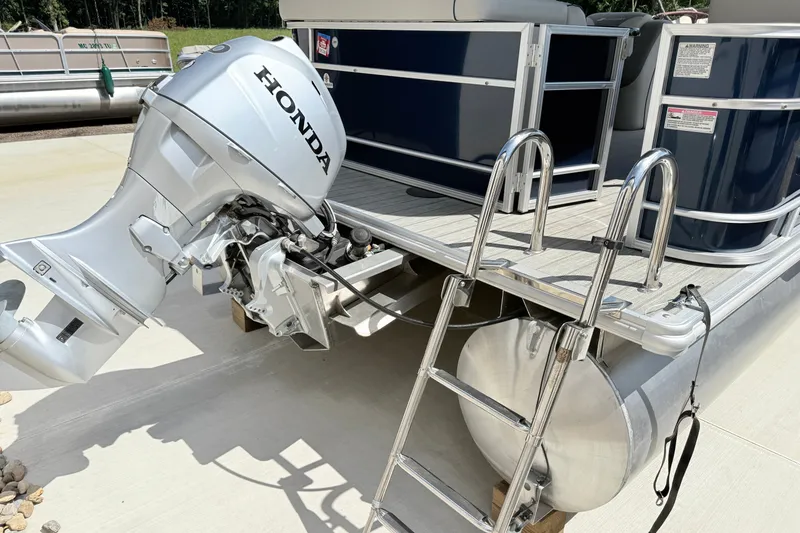 Slide: The Image of 2018 Starcraft Cruise 220 pontoon boat with Honda outboard motor and ladder. - 8
