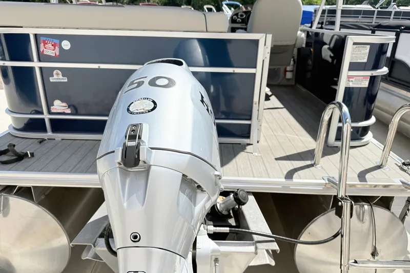 Slide: The Image of 2018 Starcraft Cruise 220 pontoon boat with a 50 HP outboard motor. - 9