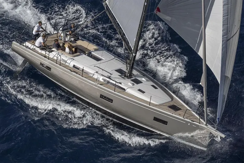 Slide: The Image of Manufacturer Provided Image: 2026 Beneteau First 44 sailing yacht navigating through ocean waves. - 1