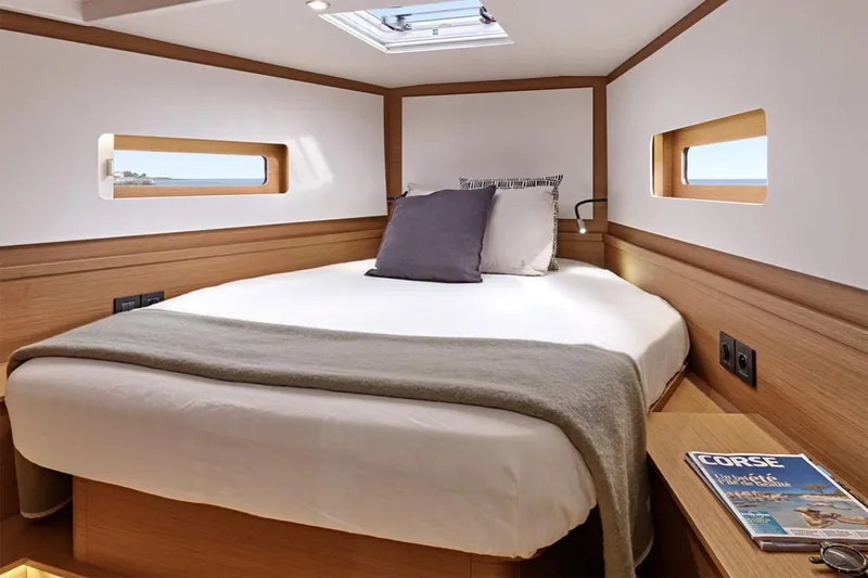 Slide: The Image of Manufacturer Provided Image: Luxurious cabin interior of 2026 Beneteau First 44 yacht with cozy bed and modern design. - 6