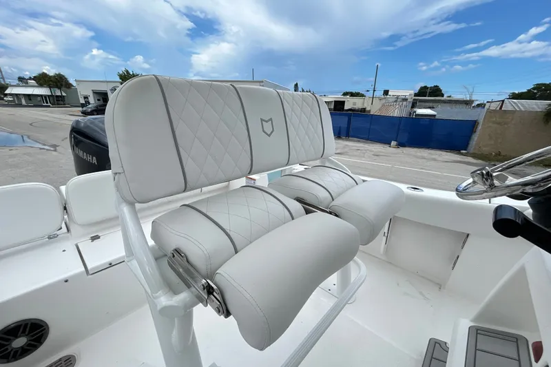 Slide: The Image of 2025 Sea Fox 228 Commander boat with plush, diamond-stitched seating and Yamaha engine. - 8