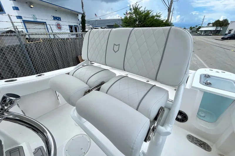 Slide: The Image of Luxurious seating on 2025 Sea Fox 228 Commander boat, featuring diamond-stitched upholstery. - 2