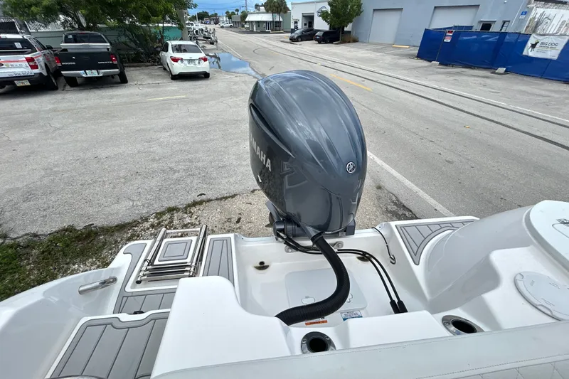 Slide: The Image of 2025 Sea Fox 228 Commander boat with Yamaha outboard motor, parked on a street. - 9