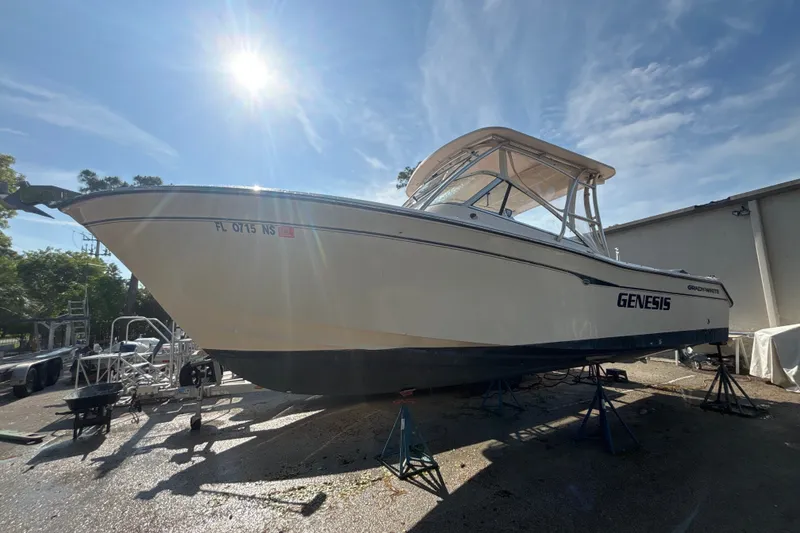 The Image of 2008 Grady-White Freedom 275 boat on stands under sunny sky. - 1