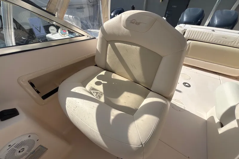 Slide: The Image of Grady-White Freedom 275 boat interior, featuring a comfortable beige seat, 2008 model. - 10