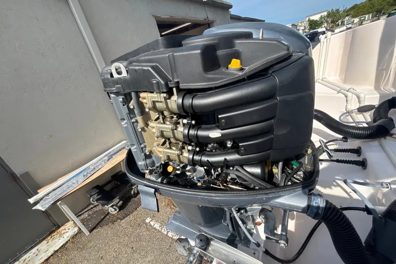 Slide: The Image of Outboard motor of a 2008 Grady-White Freedom 275 boat, detailed view. - 20