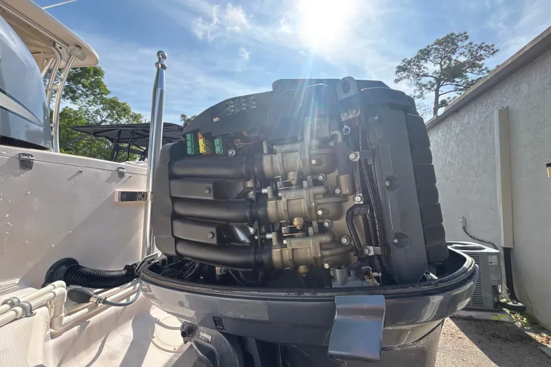 Slide: The Image of 2008 Grady-White Freedom 275 boat engine under sunlight, showcasing mechanical details. - 17