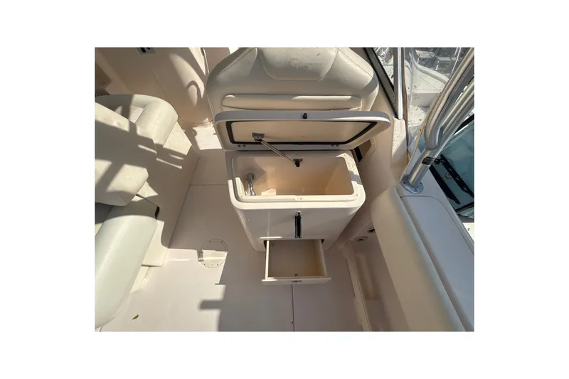 Slide: The Image of Open storage compartments on a 2008 Grady-White Freedom 275 boat interior. - 7
