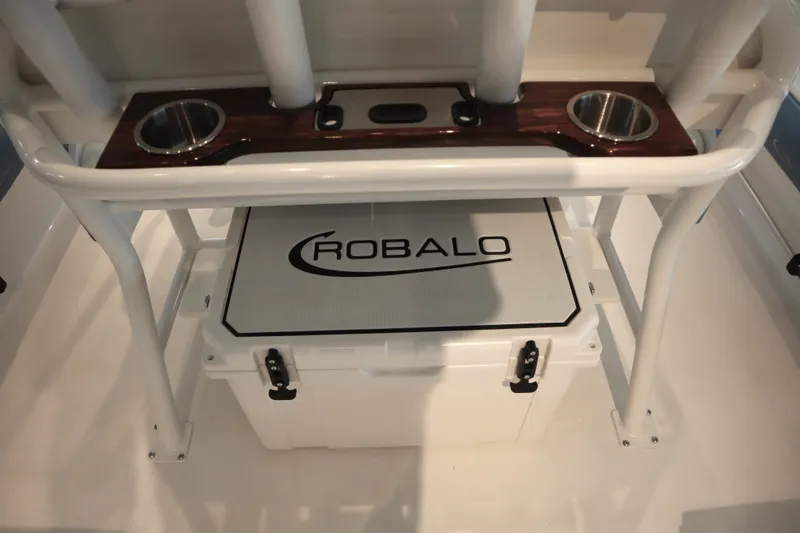 Slide: The Image of 2026 Robalo 226 Cayman boat interior with cooler and cup holders. - 21