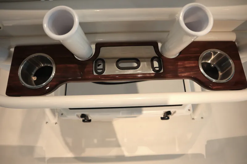 Slide: The Image of 2026 Robalo 226 Cayman boat console with cup holders and rod holders. - 20