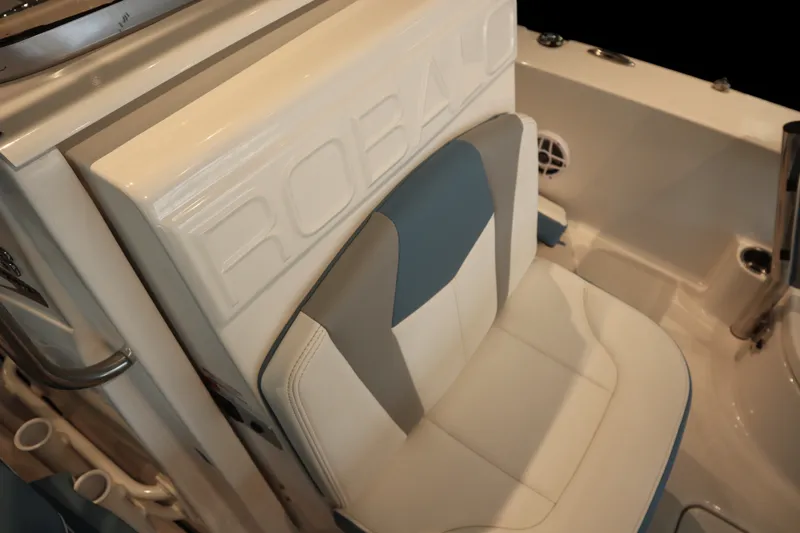 Slide: The Image of 2026 Robalo 226 Cayman boat seat with white and blue upholstery. - 11