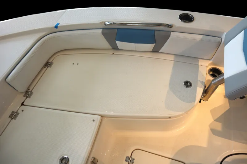 Slide: The Image of Interior view of 2026 Robalo 226 Cayman boat, featuring seating and storage compartments. - 9
