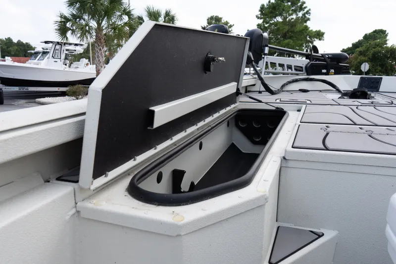 Slide: The Image of 2022 Ranger RB200 boat storage compartment with open lid, showcasing interior space. - 12