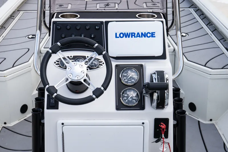 Slide: The Image of 2022 Ranger RB200 boat console with steering wheel and gauges. - 8