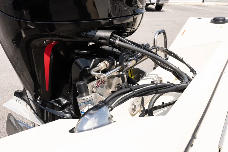 Slide: The Image of 2022 Ranger RB200 boat engine with cables and hydraulic components. - 15
