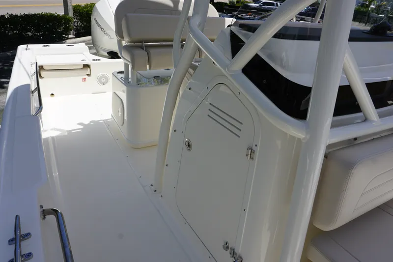 Slide: The Image of 2027 Boston Whaler 210 Montauk boat interior with seating and storage compartments. - 32