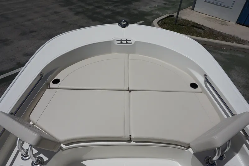 Slide: The Image of 2027 Boston Whaler 210 Montauk boat interior with cushioned seating area. - 29