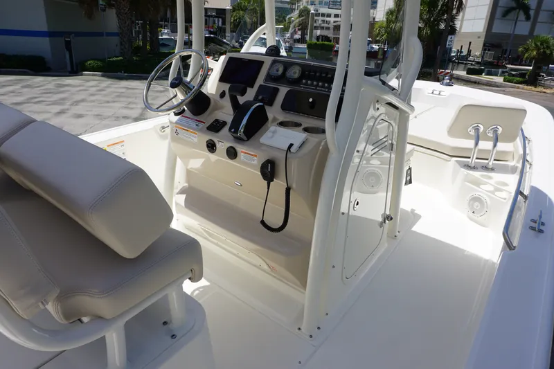 Slide: The Image of 2027 Boston Whaler 210 Montauk boat interior with steering console and seating. - 26