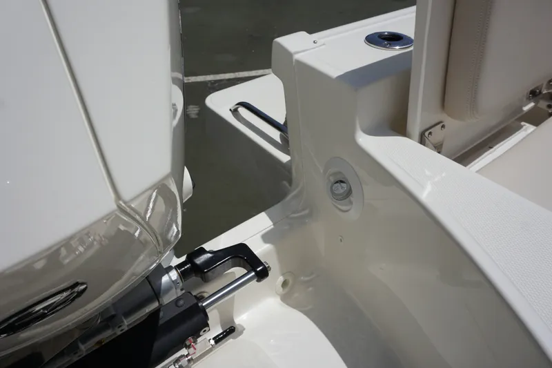 Slide: The Image of 2027 Boston Whaler 210 Montauk boat engine and seating detail. - 14