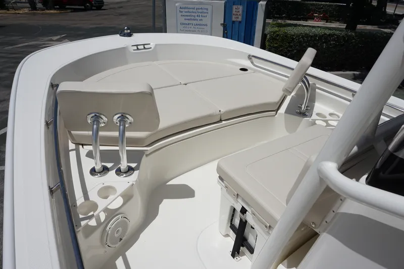 Slide: The Image of 2027 Boston Whaler 210 Montauk boat interior with cushioned seating and stainless steel fixtures. - 28