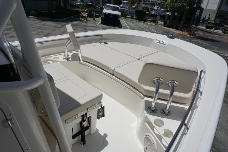 Slide: The Image of 2027 Boston Whaler 210 Montauk boat interior with cushioned seating and stainless steel fixtures. - 27