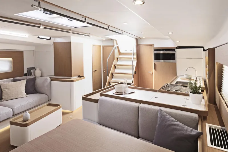 Slide: The Image of Manufacturer Provided Image: Luxurious interior of 2026 Beneteau First 53 yacht with modern kitchen and seating area. - 7