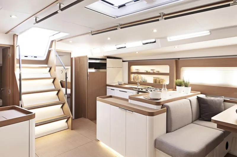 Slide: The Image of Manufacturer Provided Image: Luxurious interior of 2026 Beneteau First 53 yacht, featuring modern kitchen and seating area. - 5