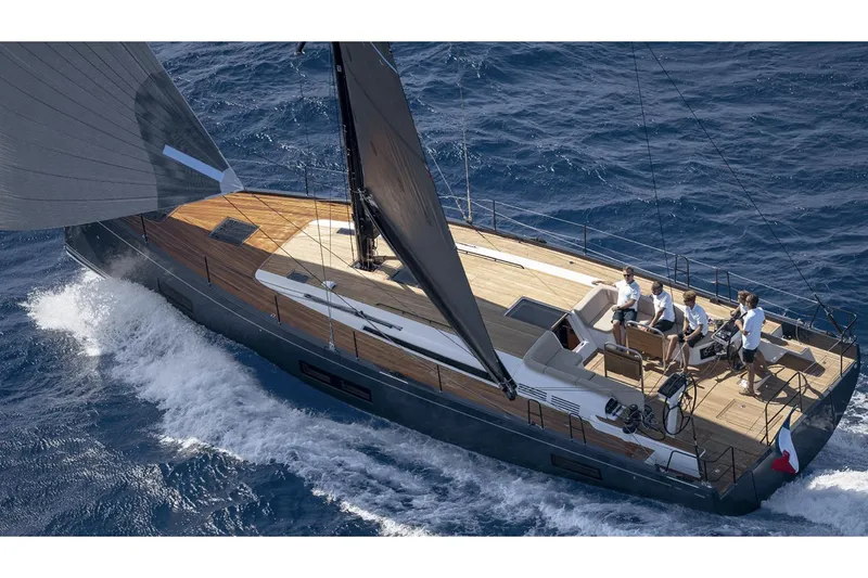 Slide: The Image of Manufacturer Provided Image: 2026 Beneteau First 53 sailing yacht cruising on open sea with crew onboard. - 3