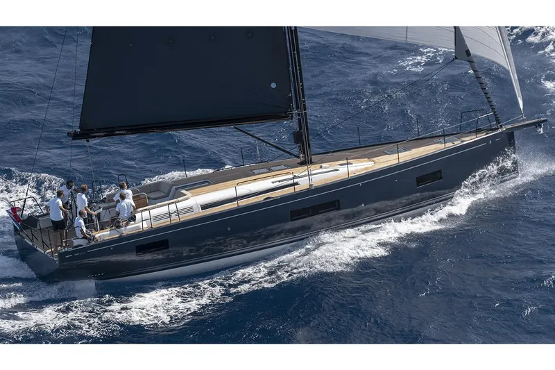 Slide: The Image of Manufacturer Provided Image: 2026 Beneteau First 53 sailing yacht on open sea, sleek design, cutting through waves. - 1
