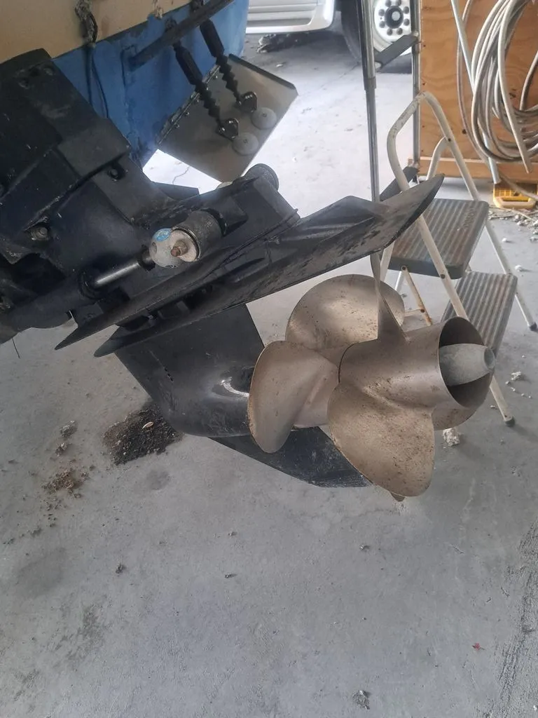 Slide: The Image of Close-up of a boat propeller and drive system in a garage. - 12