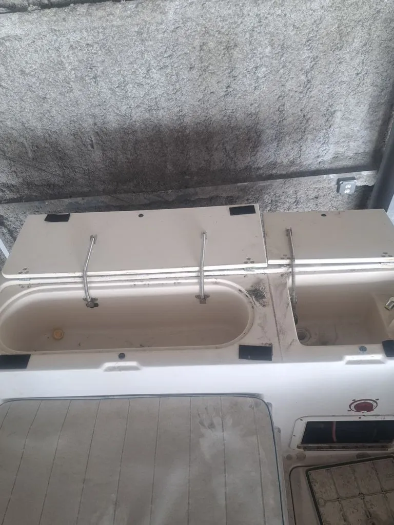 Slide: The Image of The image shows the interior of a 1997 Pro-Line 2700 Sportsman with open storage compartments. - 6