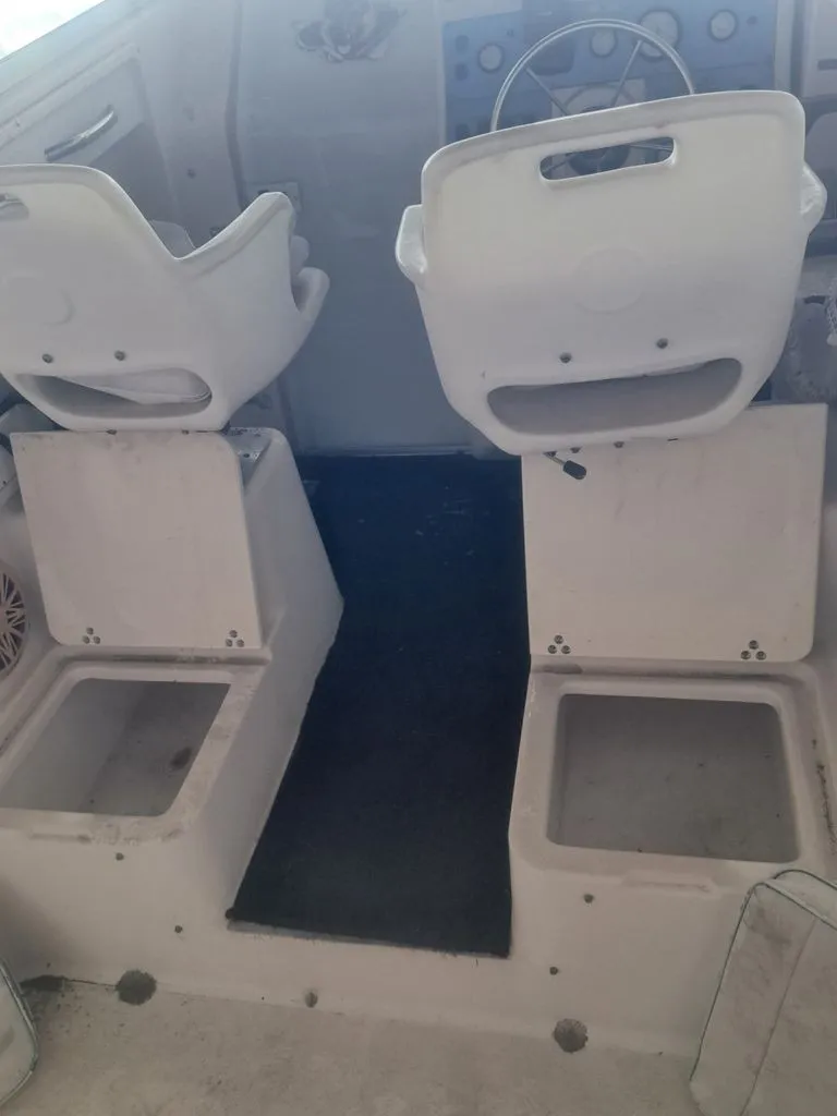 Slide: The Image of The image shows the cockpit of a 1997 Pro-Line 2700 Sportsman with two white seats. - 4