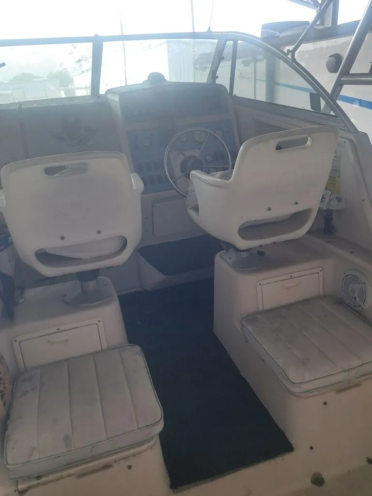 Slide: The Image of The image shows the cockpit of a 1997 Pro-Line 2700 Sportsman with two white seats. - 5