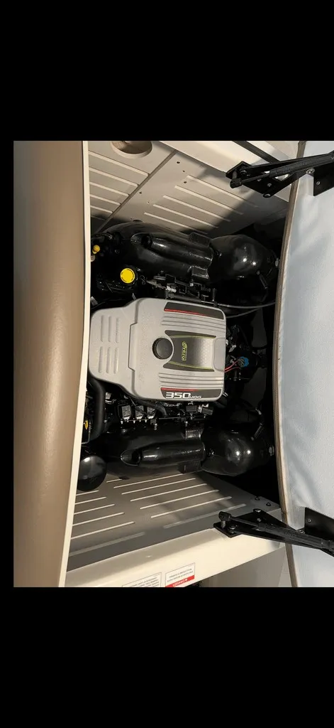Slide: The Image of The engine compartment of a 2013 Sea Ray 210 SLX with a 350 HP engine. - 19