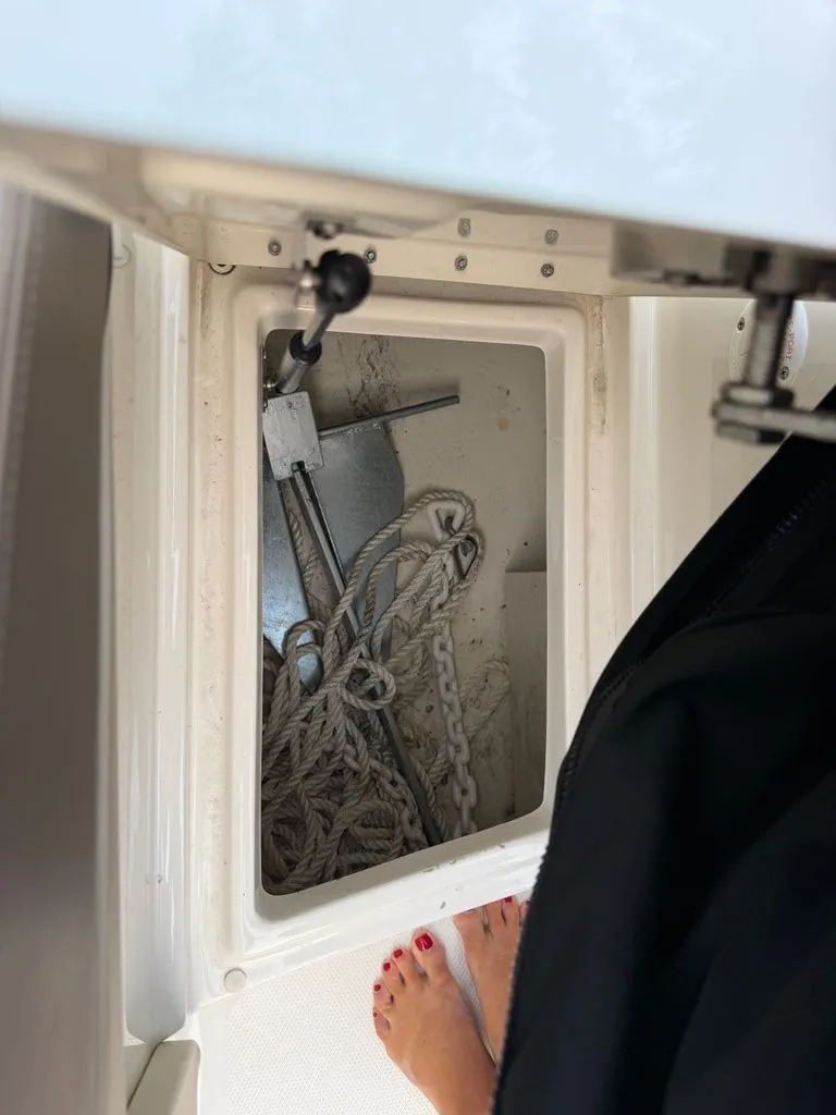 Slide: The Image of An anchor locker with an anchor and rope on a boat. - 14