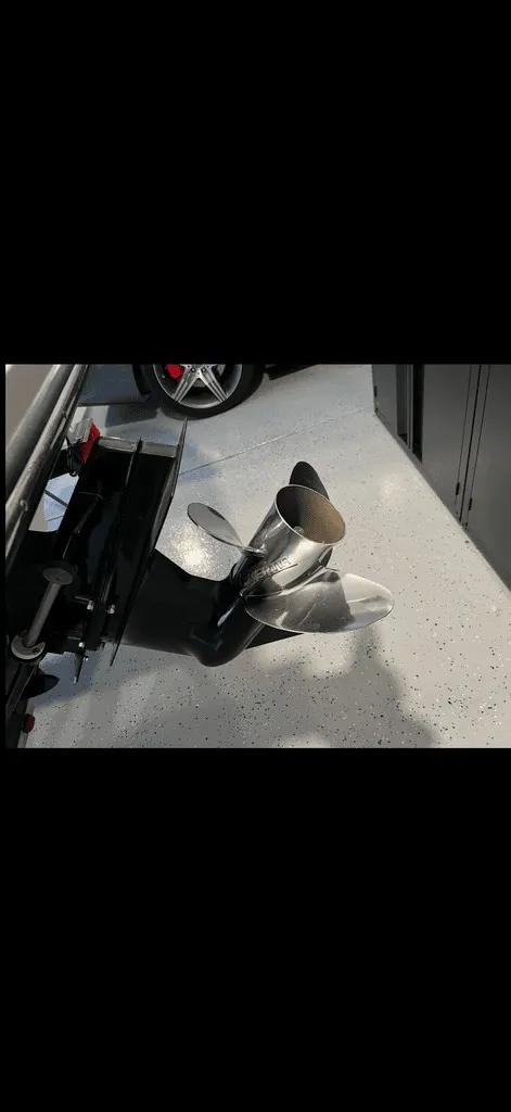Slide: The Image of Propeller of a 2013 Sea Ray 210 SLX boat in a garage. - 21
