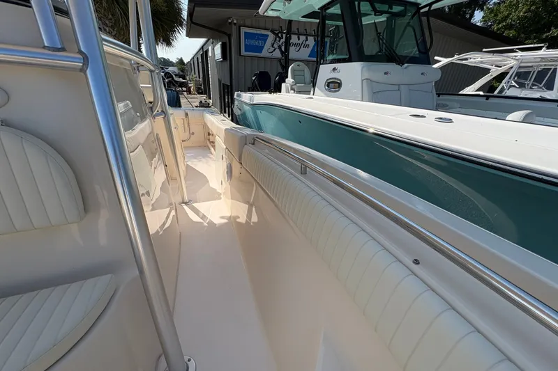 Slide: The Image of 2011 Grady-White Canyon 283 boat interior with sleek seating and polished railings. - 9