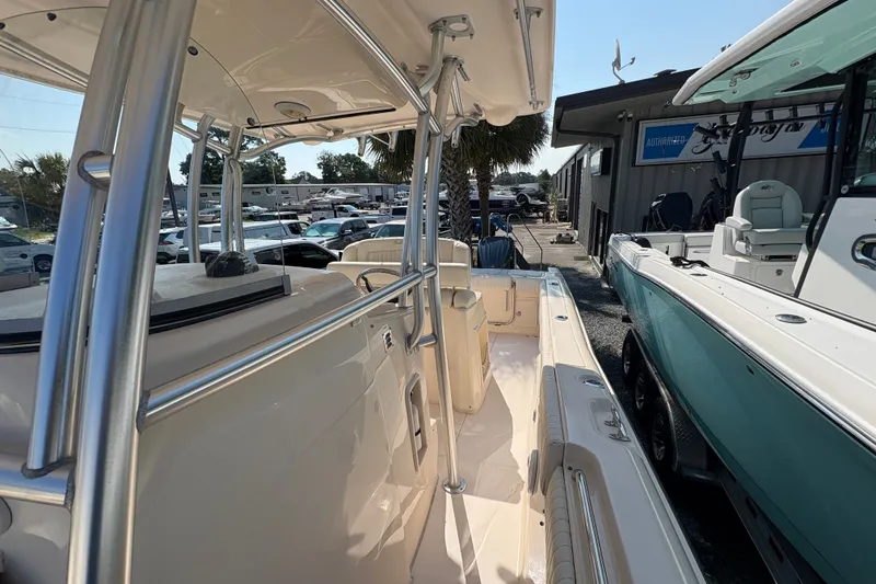 Slide: The Image of 2011 Grady-White Canyon 283 boat, side view, docked at a marina. - 10