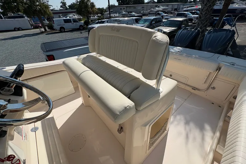 Slide: The Image of 2011 Grady-White Canyon 283 boat interior with helm seating and steering wheel. - 20