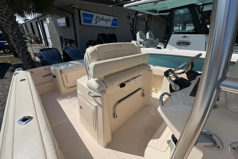 Slide: The Image of 2011 Grady-White Canyon 283 boat interior with helm and seating area. - 16