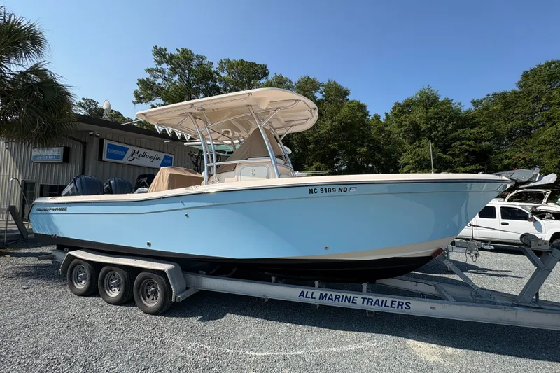 The Image of 2011 Grady-White Canyon 283 boat on trailer, parked outdoors. - 0