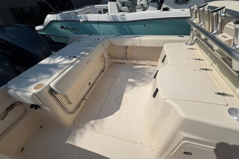 Slide: The Image of 2011 Grady-White Canyon 283 boat interior with seating and storage compartments. - 24