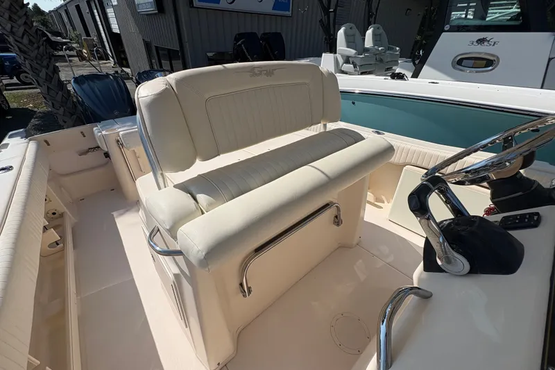 Slide: The Image of 2011 Grady-White Canyon 283 boat interior with helm and seating area. - 17