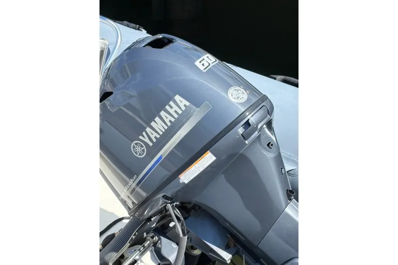 Slide: The Image of Yamaha outboard motor on a 2015 Zodiac Bayrunner 500 boat. - 4