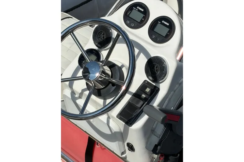 Slide: The Image of Steering console of 2015 Zodiac Bayrunner 500 boat with Yamaha gauges and controls. - 3